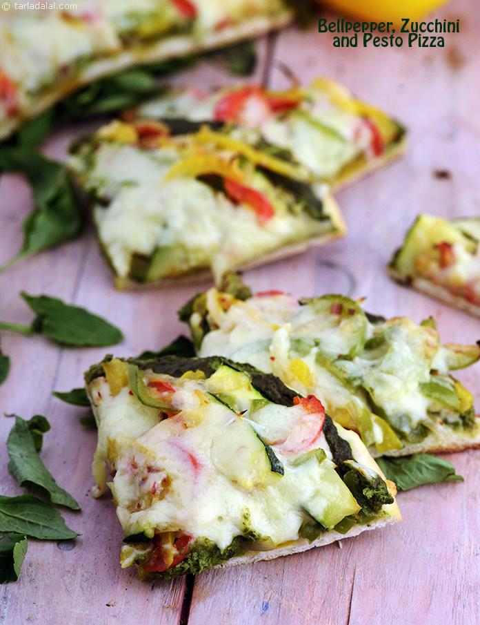 A thin crust pizza topped with pesto and a colourful combination of fresh vegetables, cheese and then baked to perfection.