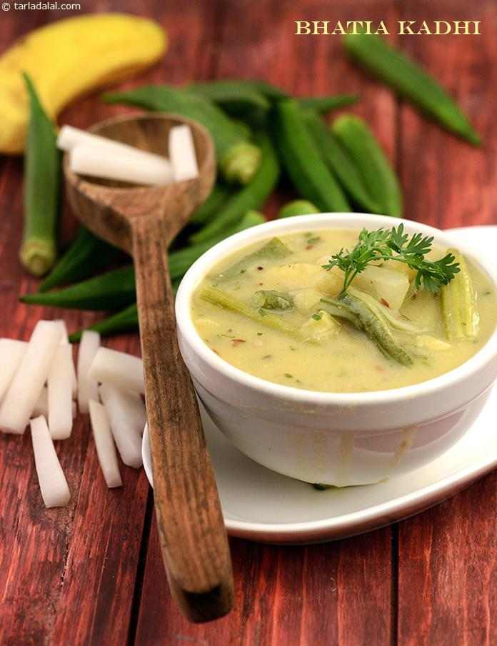Bhatia Kadhi is a sweet and sour version made with cooked toovar dal water, curds and vegetables. This interesting combination of ingredients makes all the difference—be it in terms of taste or aroma. You can even add sliced potatoes to this recipe.
