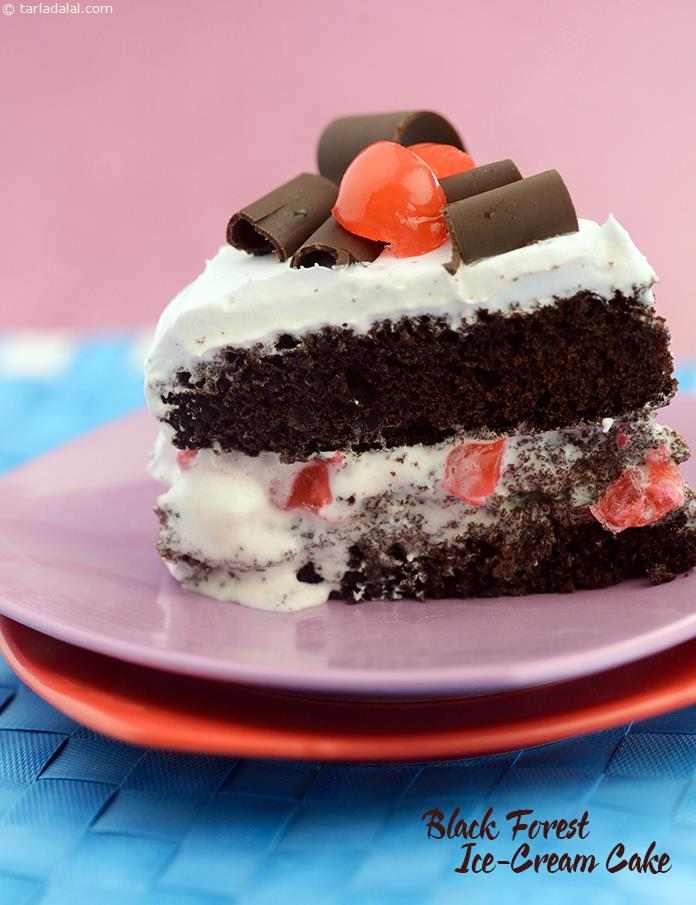 Black Forest Ice- Cream Cake, vanilla ice-cream interlaced with cherries and grated chocolate is sandwiched between the chocolate sponge to make an interesting variation of the traditional black forest cake.