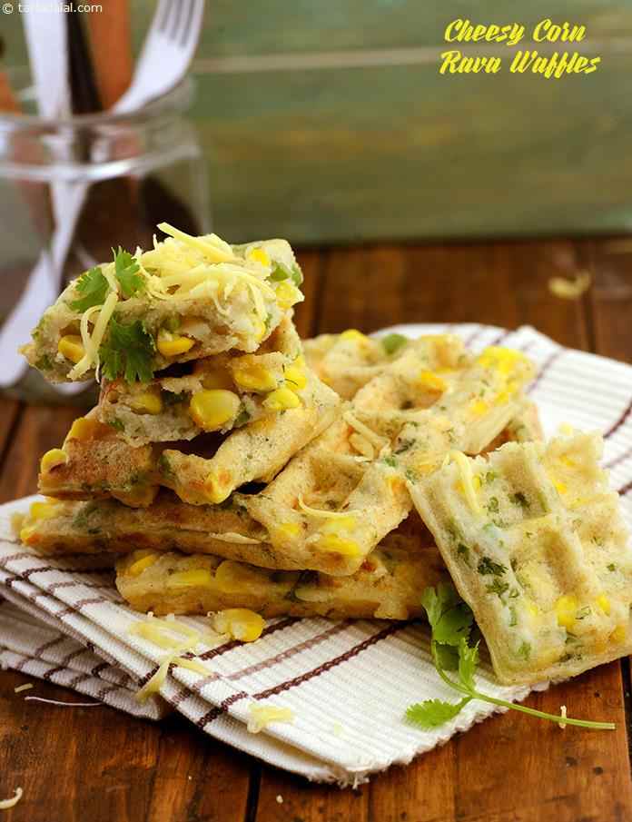 Cheesy Corn Rava Waffles, these crunchy waffles are made with a batter of semolina and urad dal flour with crunchy sweet corn, curds and capsicum, enhanced with a proper mix of spices. 