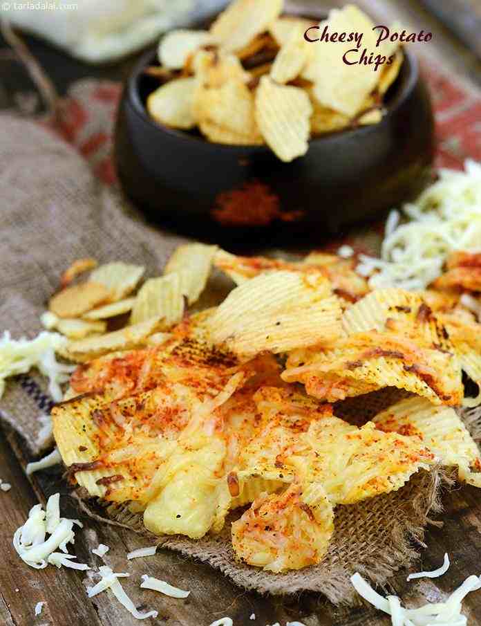 Cheesy Potato Chips, a quick fix accompaniment that you can use to spice up a simple layout of burgers and smoothies! cheesy potato chips can be easily made using ready-made chips.