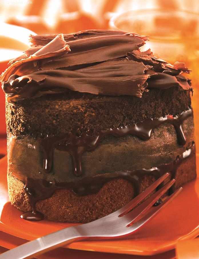 Chocolate Brownie Mousse Cake an indulgent dessert of soft chocolate mousse layered between chocolate cakes and microwaved for a few seconds for a mouth licking chocolate ooze.