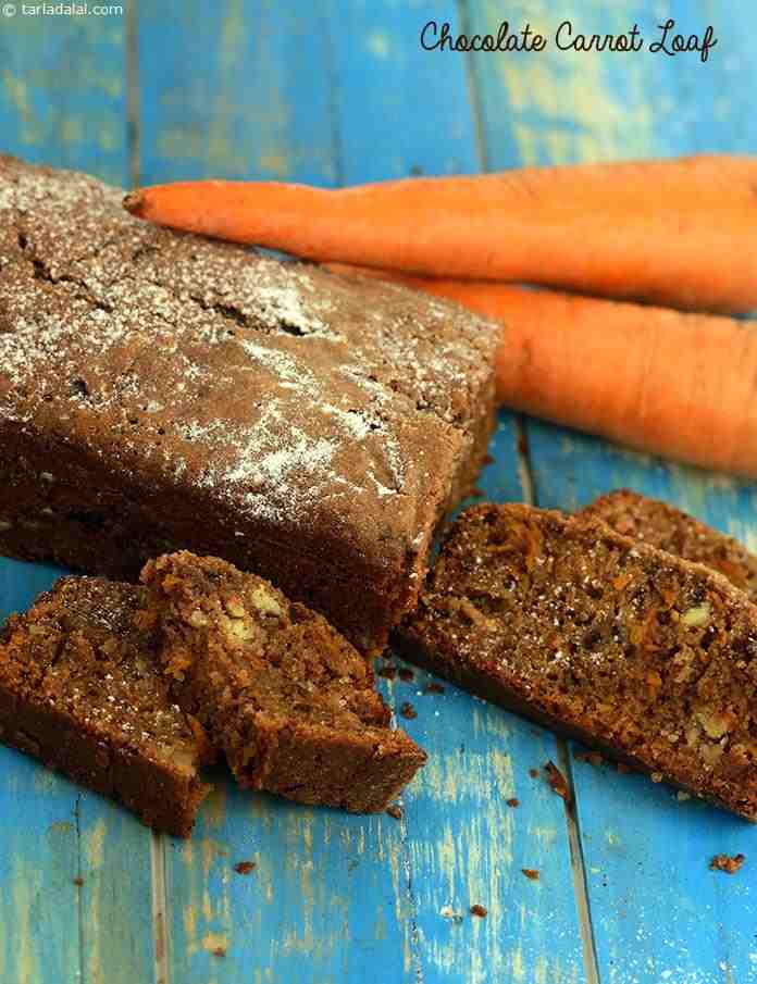 Chocolate Carrot Loaf, you will love the rustic flavour of this honey flavoured chocolate cake, reinforced with grated carrot, nuts and raisins.Condensed milk gives it a very rich and intense flavour.