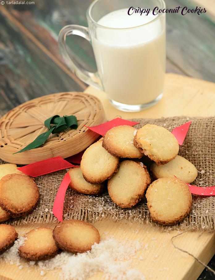 Nothing can beat the rich mouth-feel and chewy delightfulness of Crispy Coconut Cookies. The appealing aroma of baked coconut and melted butter that emanates from the oven will draw you to bite into a cookie as soon as it is out of the oven.