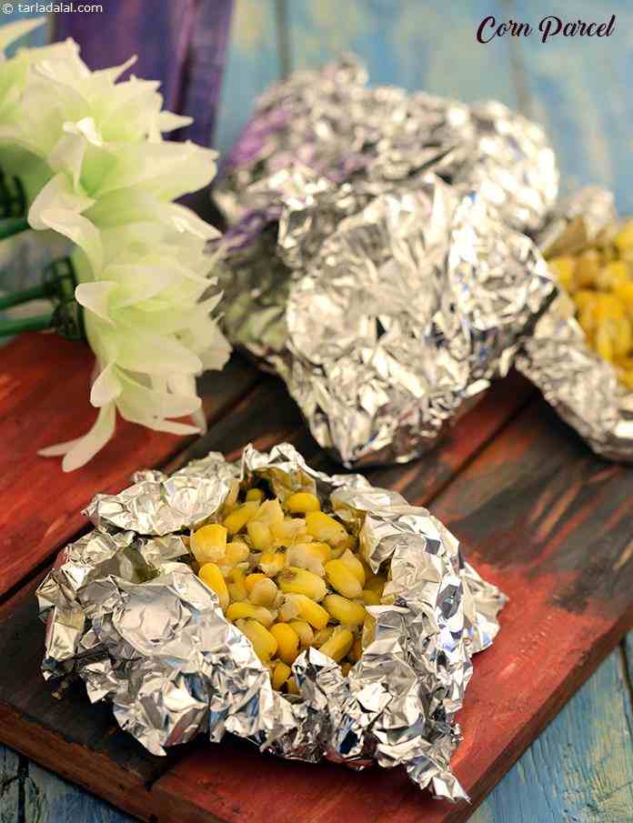 Corn Parcel, an exciting mixture of onions, sweet corn, fresh cream and curds pepped up with green chillies and coriander, is foil-packed and baked in a pre-heated oven, ready to be delivered to your guests when they arrive.
