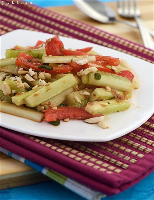Cucumber Yam, fresh cucumber and tomatoes in a sweet sour dressing with crunchy peanuts.