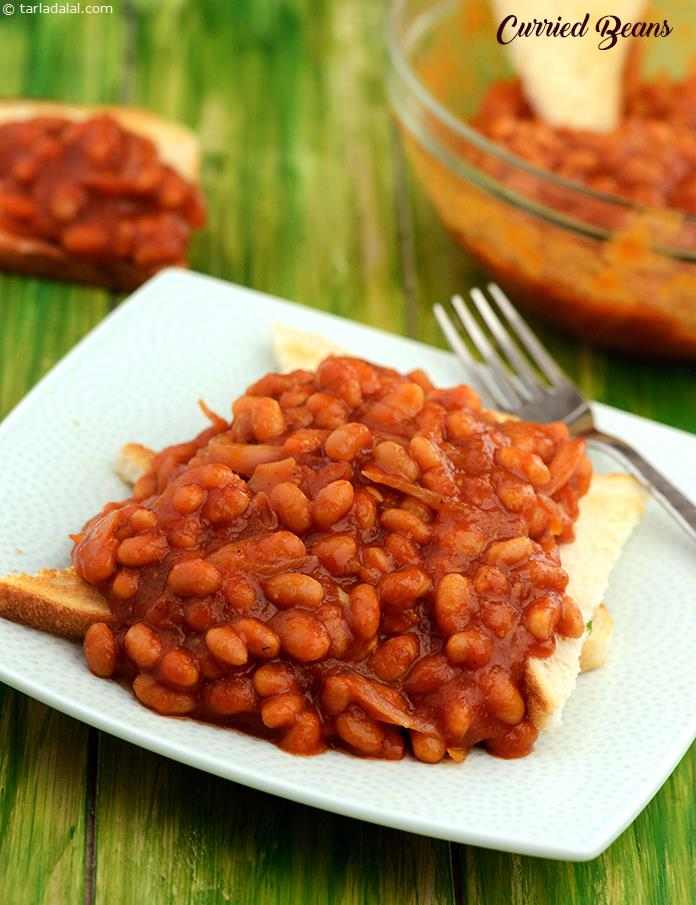 Baked beans are perked up with onions, garlic paste, curry powder, etc. The resulting Curried Beans is much more exciting to the palate, and can be served with bread toast to make a satiating snack or even a quick meal!