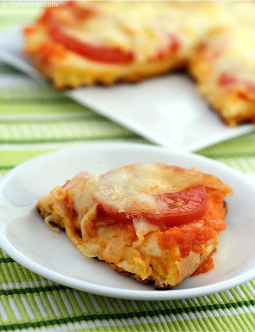 Deep Dish Tomato Cheese Delight s a thick crust pizza cooked in a deep pie-dish with interlaced layers of tomato and mozzarella cheese.