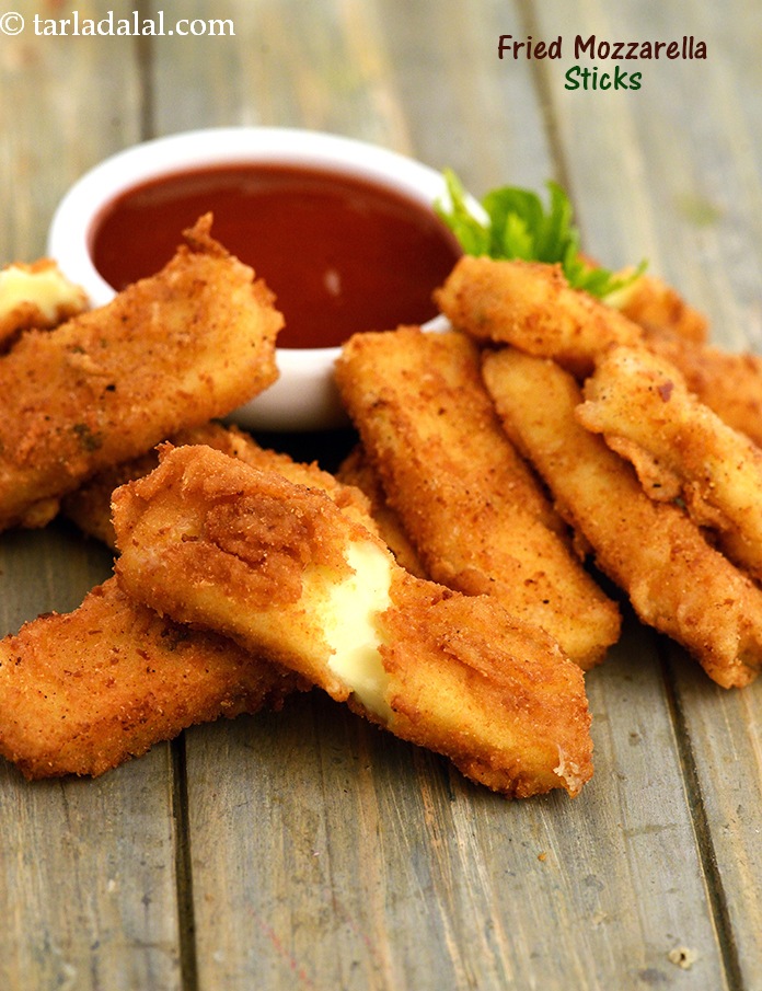 Fried Mozzarella Sticks, this crunchy accompaniment is cheese, cheese and cheese all the way through, so nothing can please cheese-lovers more! a simple flavouring of oregano and chilli-flakes ensures that the overall effect is very pleasing.