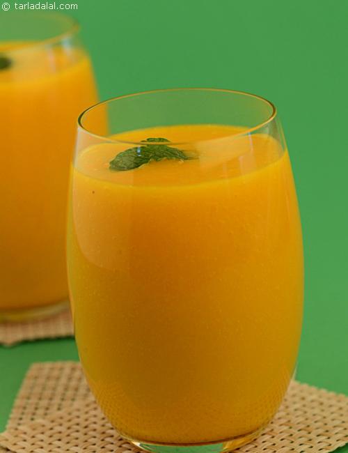 Golden Punch, a blend of tangy sweet mangoes and  pineapple topped with ice and mint sprigs.