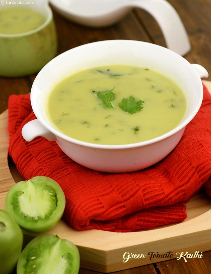 Green tomato kadhi is tangy and spicy kadhi with combination of green tomatoes and green chillies. It is thickened with coconut. Serve hot with roti or rice