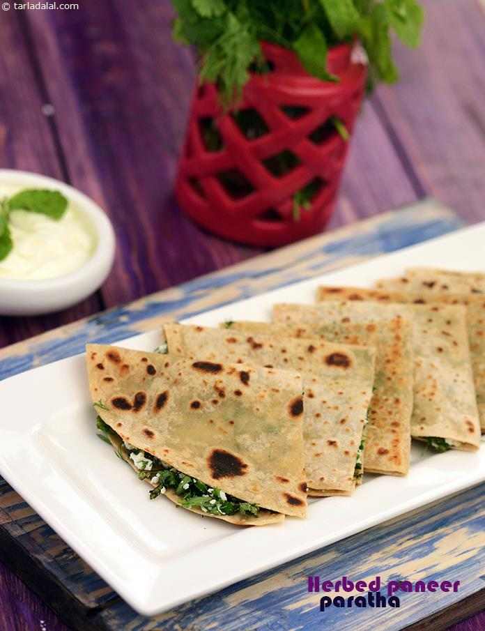 Herbed Paneer Paratha, A really nutritious combination of iron-rich fresh greens and paneer, which is packed with calcium, vitamin b2 and protein. Serve with fresh curds for a wholesome and filling breakfast. 