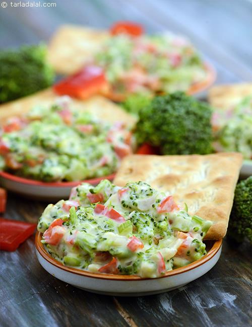 Hot Broccoli Dip, a hot and spicy chunky dip made with celery, broccoli, onions and red pepper mixed with cheese and butter.