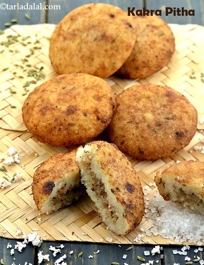 Kakra Pitha ( Deep Fried Semolina Balls with Sweet Coconut Stuffing)