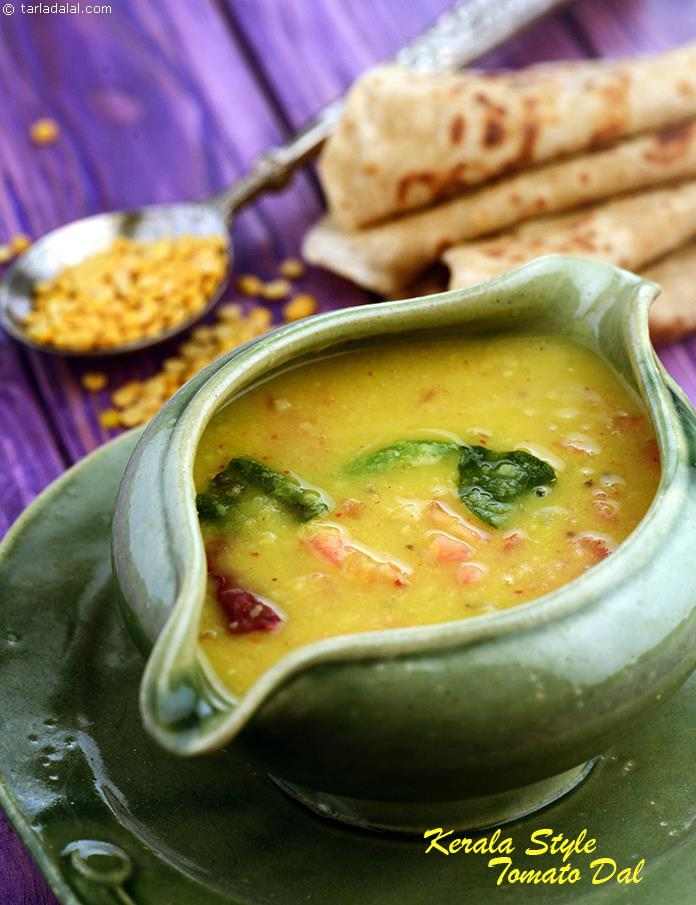 Kerala Style Tomato Dal, toovar dal is cooked with a ground paste of coconut, red chilies and jeera, while tomatoes and jaggery enhance the flavor. The dal is tempered  with curry leaves and mustard seeds.