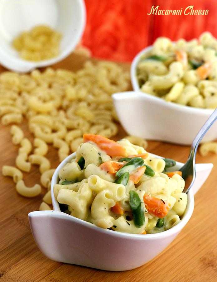 Macaroni Cheese, macaroni mixed with vegetables and cheese and cooked with white sauce and herbs makes a tasty and wholesome meal that the kids are sure to love.