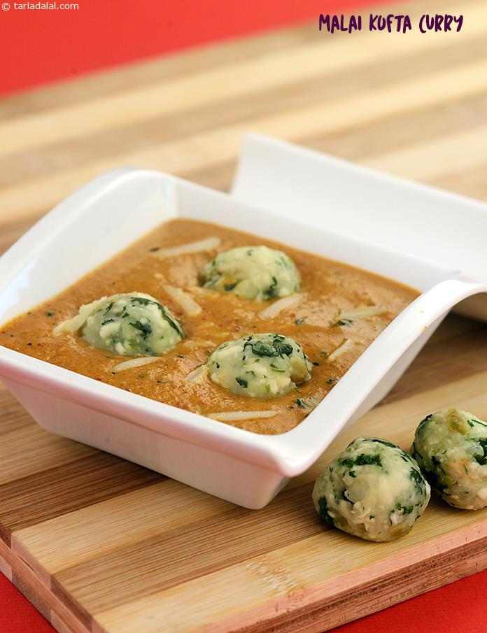 Malai Kofta Curry,a simple yet flavourful tomato-based curry takes on a rich form with the addition of potato and cottage cheese kofta stuffed with dry fruits.