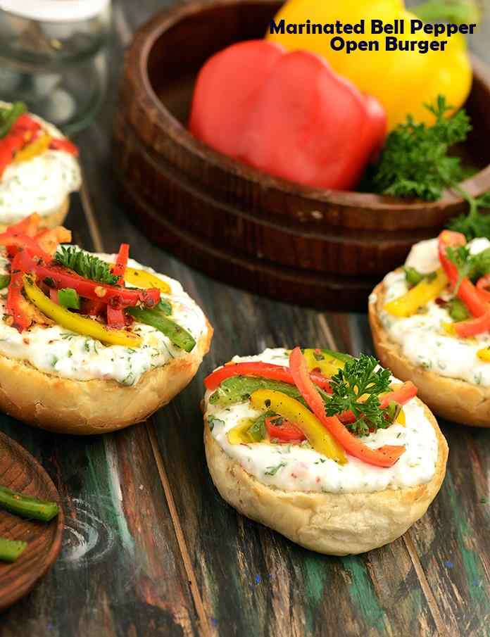 Marinated Bell Peppers Open Burge, colourful and crunchy bell peppers marinated in herbed olive oil decorate crispy burger buns together with a homemade parsley cream cheese. 