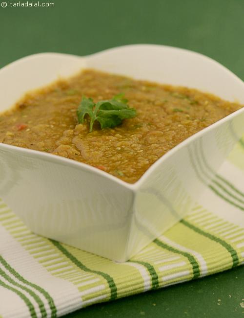 Masala Masoor Dal cooked and simmered with onion, tomatoes and spices.