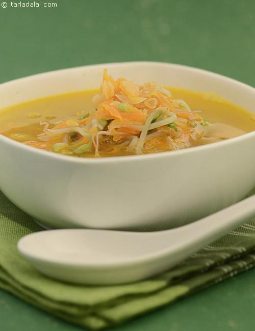 Masoor Dal and Carrot Soup, topped with bean sprouts.
