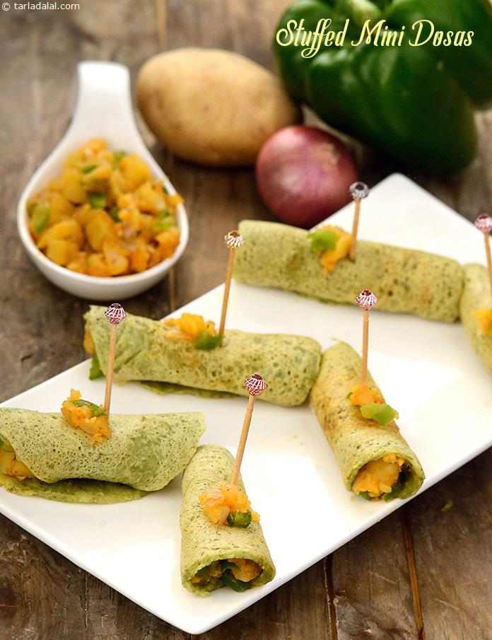 The mini dosas are conveniently made of a green gram based batter. To add to the crispy excitement of these dosas, they are stuffed with a succulent potato and capsicum mixture, which makes this handy-sized snack a thrilling mouthful indeed!