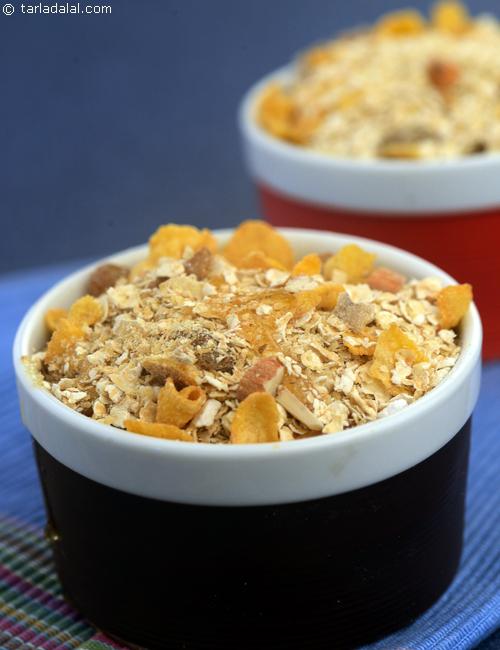 Muesli with Honey, a healthy mix of oats, corn flakes, nuts and raisins drizzled with honey, have it with milk and fresh fruits for a hearty breakfast.
