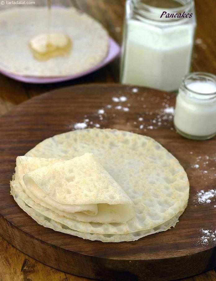 Pancakes, they may be had for breakfast with a dollop of honey, a blob of butter and a scoop of fresh jam, or they may form the base for other desserts or savoury preparations. Here is an easy way to make eggless pancakes at home.