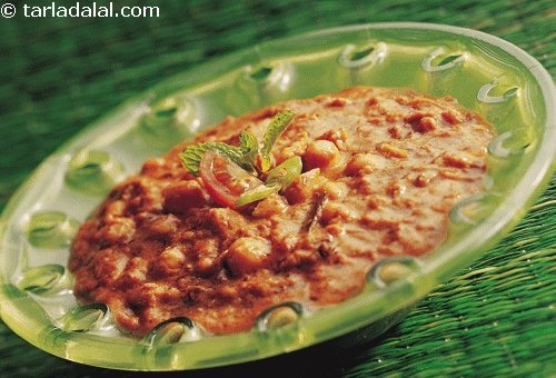 Panchratni Dal is a mix of Indian lentils cooked with spices and garnished with cherry tomatoes.