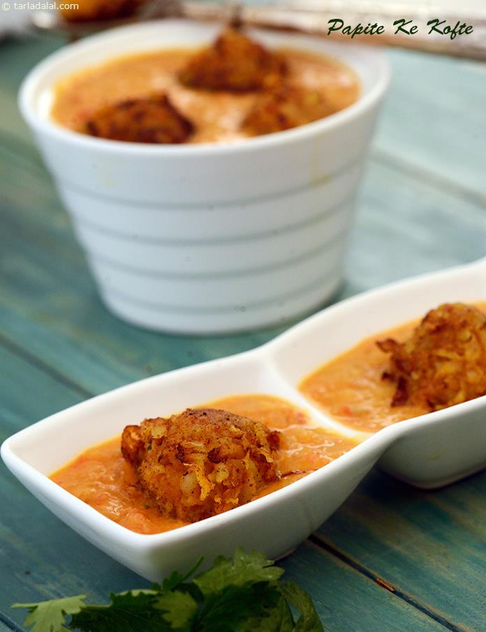 Papite Ke Kofte, grated papaya held together by mashed potatoes is made into crisp deep-fried koftas that are mixed into a sumptuous gravy that is rich, creamy and tangy too!