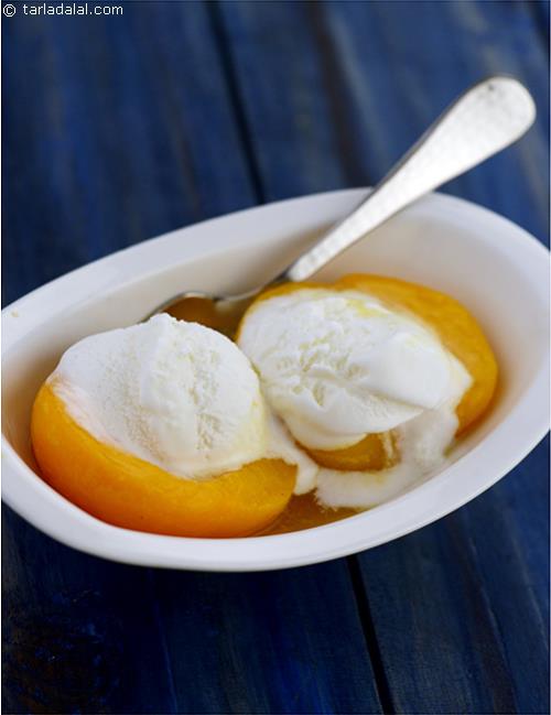 Peach Romanoff is quick warm dessert made by flambeing peaches with brandy and orange juice and then served with creamy vanilla ice-cream and fresh cream.