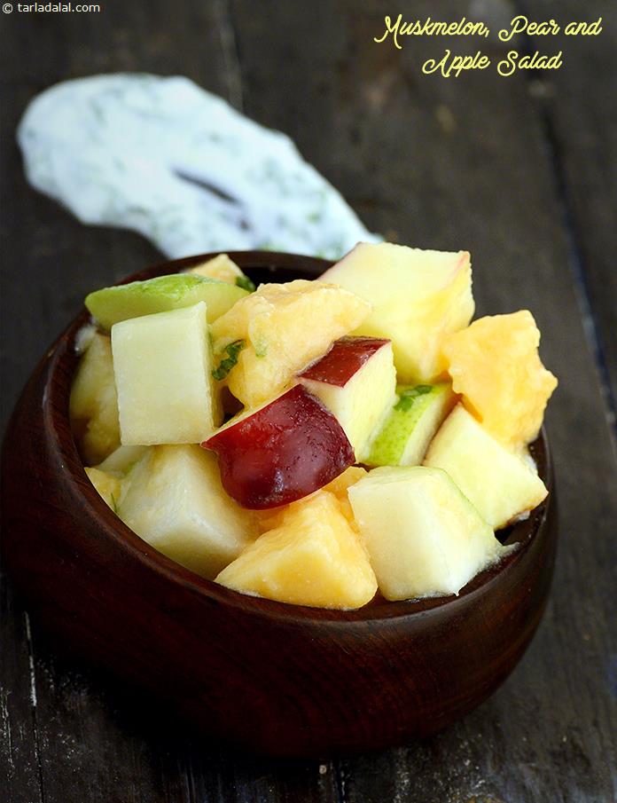 Muskmelon, Pear and Apple Salad in low-cal curd based parsley dressing is a yummy treat for diabetics and others as well.