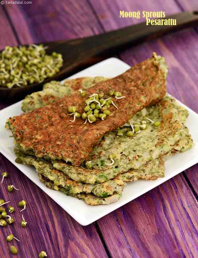 This dosa is made using sprouted moong with a little besan for binding, instead of the usual batter of moong dal and rice. Spiced with green chllies and ginger, this Moong Sprouts Pesarattu gets all the more toothsome with the addition of onions.