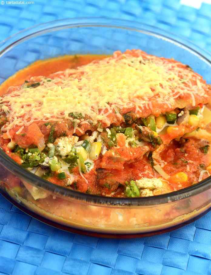 Pomodoro Lasagne, the rich baked dish is packed with layers of pasta filled with vegetables and tomatoes topped with Italian mozzarella cheese and baked until golden brown in colour.