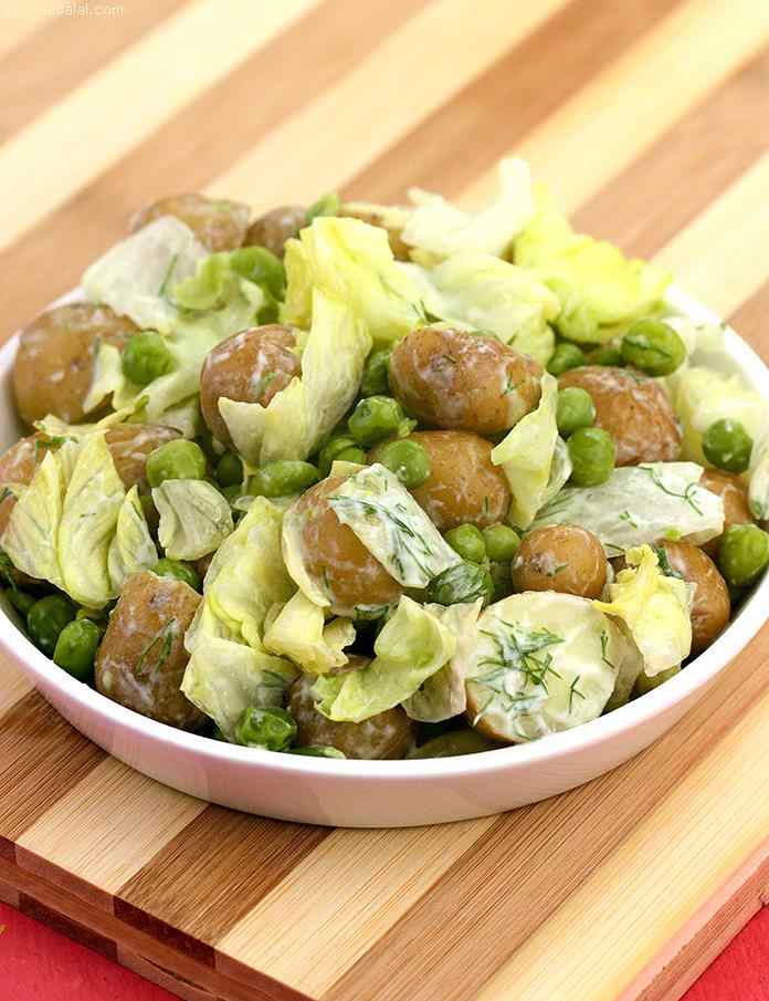 Potato and Peas Salad tossed in low fat dill flavoured curd dressing.