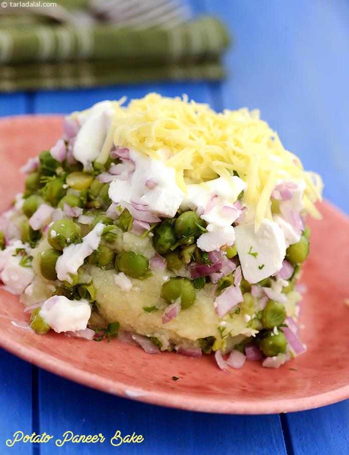 Potato Paneer Bake, layers of mashed potato, green peas and paneer aptly spiced and perked up with lemon juice, are topped with curd-cream and baked till perfectly done.