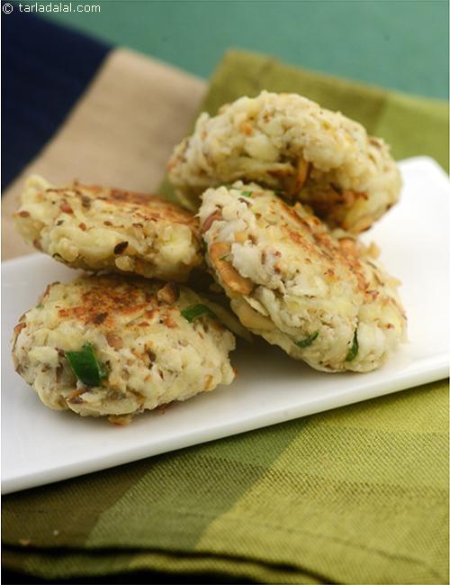 Raw Banana Rosti, a classic Jain version of an authentic Swiss dish.Crispy rostis flavoured with roasted peanuts, and spiced up with cumin seeds and green chillies.