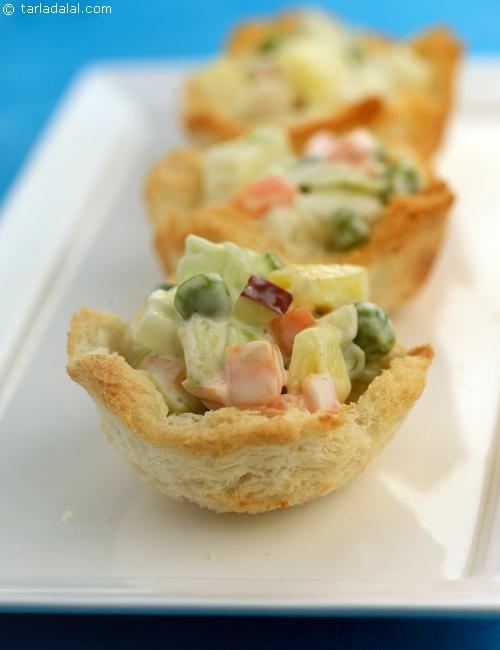 Russian Salad Bread Cups, whole wheat toast case filled with creamy boiled vegetables and apple, the addition of mayonnaise binds the flavours.