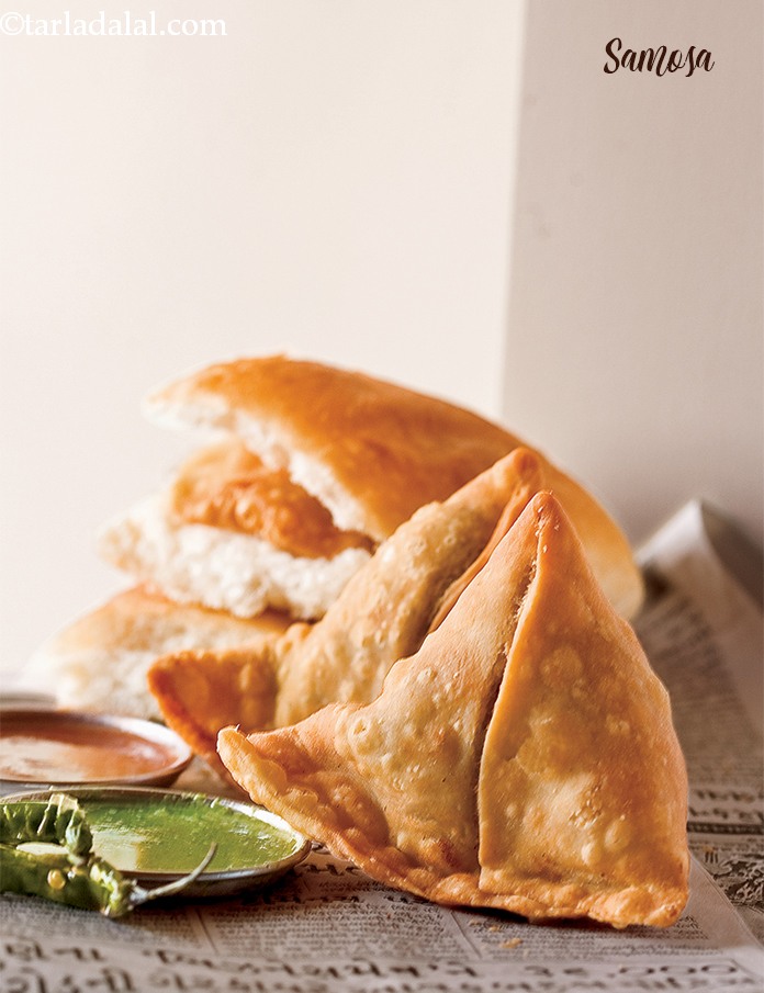 Samosa is a popular Indian snack stuffed with  potatoes and green peas.