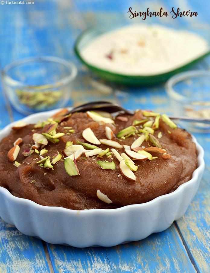 Singhada Sheera , the use of ghee and the addition of cardamom powder give the sheera a very rich aroma, typical of most Indian sweets. Garnish generously with nuts, to add to the sumptuousness of this delightful dessert.