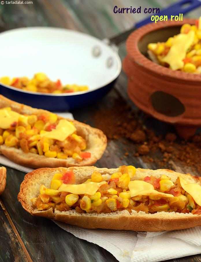 An innovative filling of curried sweet corn bound together by milk thickened with bread, adds immense value to simple hot dog rolls. Baked with a topping of cheese, the Curried Corn Open Hot Dog Roll is perfect to be served at garden parties. 