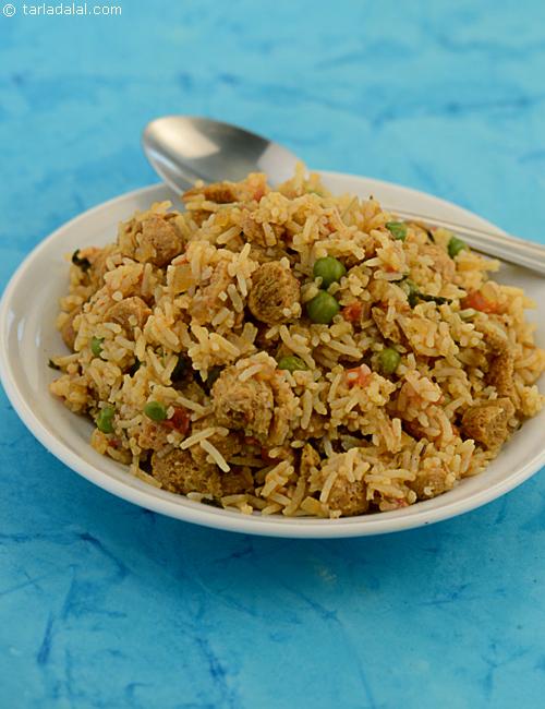 Soya Pulao, fragrant rice gently mixed with soya and green peas gravy.