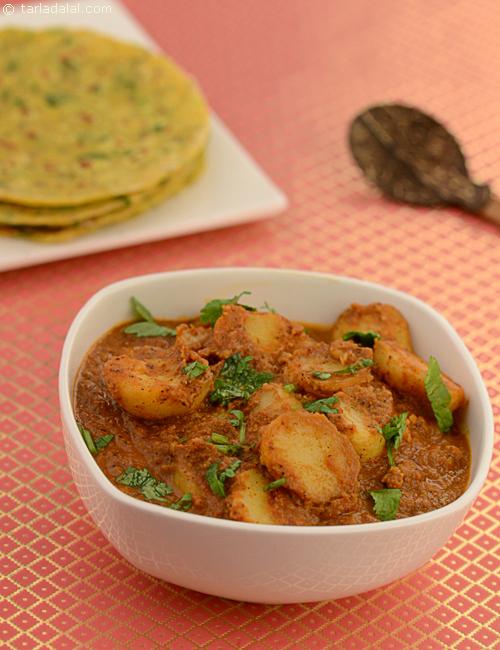 Spicy Aloo, baby potatoes deep fried and simmered in a tomato based gravy with an aromatic mixture of spices.