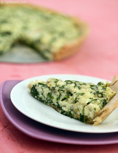 Spinach and Ricotta Pie is a classic pizza pie, a whole meal pizza pie enclosing a filling of garlic, spinach, ricotta cheese, cheese and sultanas, baked and served warm.