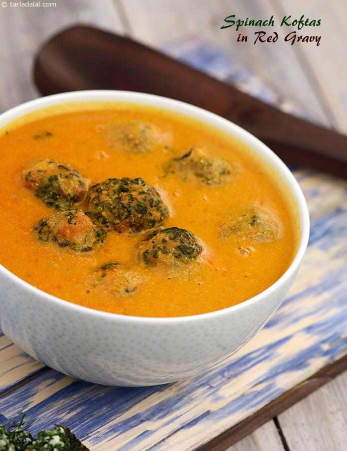 A variety of spices including charoli, jeera, khus khus and dhania ground along with coconut and onions and added to the tomato-based gravy, gives a vibrant feel to the Spinach Kofta in Red Gravy.