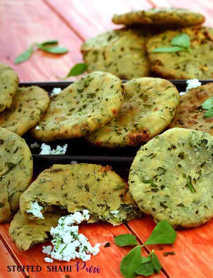 Stuffed Shahi Puri, dough prepared with flour and methi, is stuffed with a rich paneer mixture, rolled into puris and deep-fried in oil.