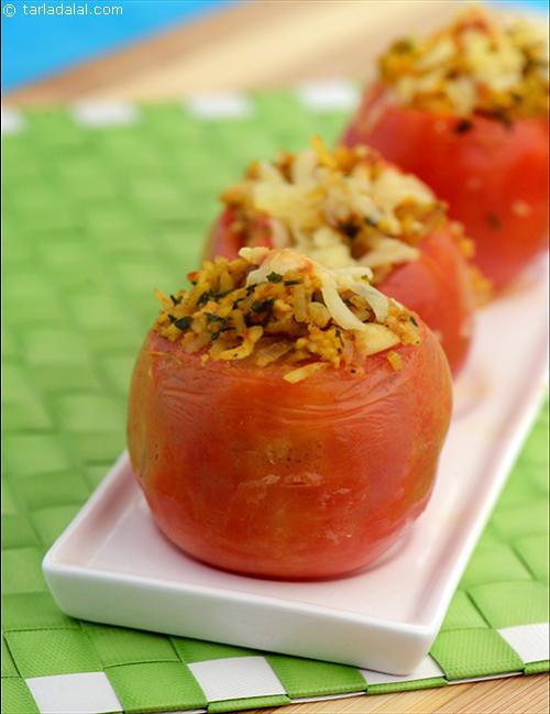 Stuffed Tomato, the rich dry fruit stuffing is assembled in tomato shells and baked till the shells are soft and moist to bite into.