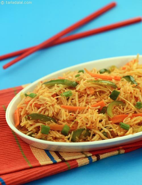Triple Schezuan Rice, a wholesome combination of sauteed vegetables, noodles and rice tossed in schezuan sauce.