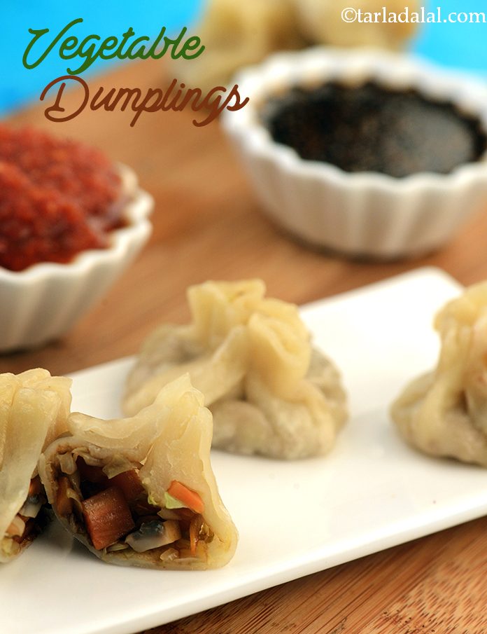 Vegetable Dumplings,  vegetables filled dim sums served with tangy sweet soy sauce and spicy red chilli sauce.