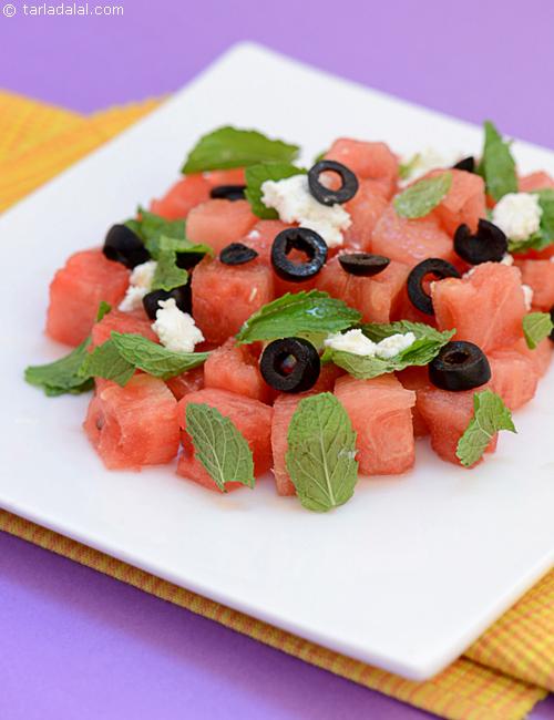 Watermelon and Feta Cheese Salad with black olives, mint leaves and honey dressing.